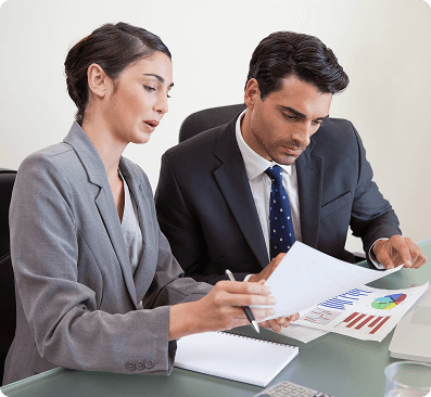 Sales persons working with notebook
